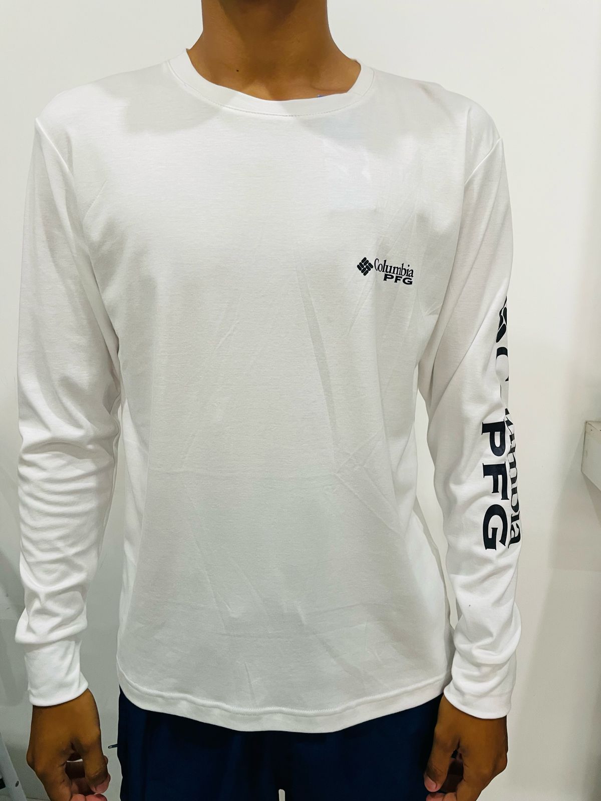 Polo manga larga Columbia blanco / Logo negro