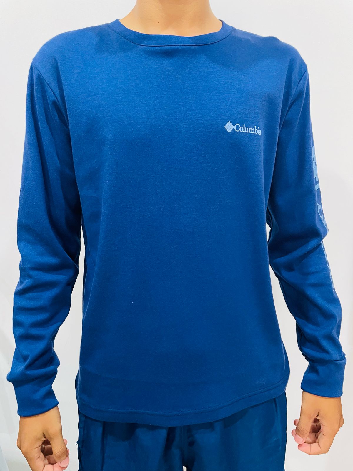 Polo manga larga Columbia azul / Logo celeste
