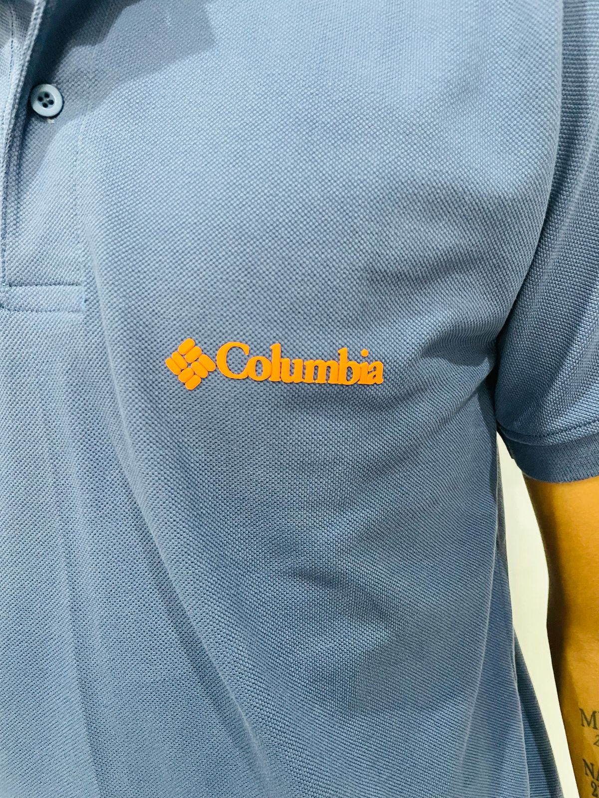 Polo camisero Columbia azul / Logo naranja