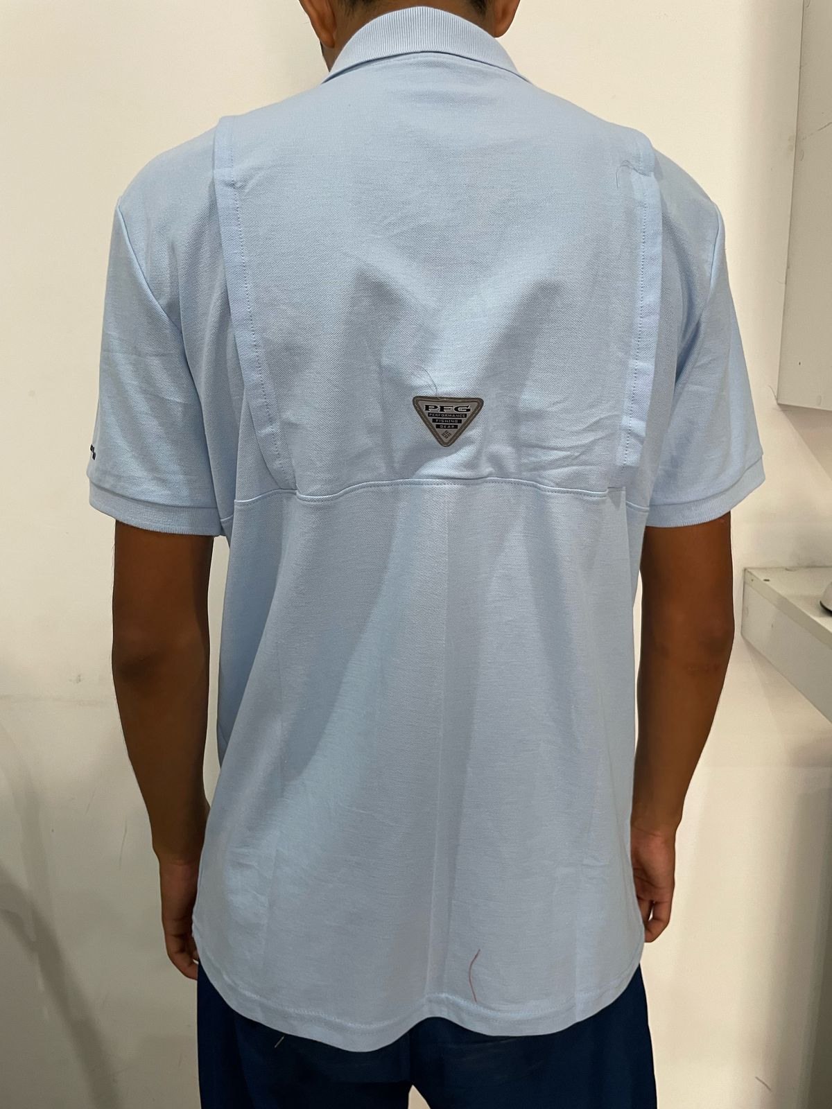 Polo camisero Columbia celeste - logo blanco / Respirador